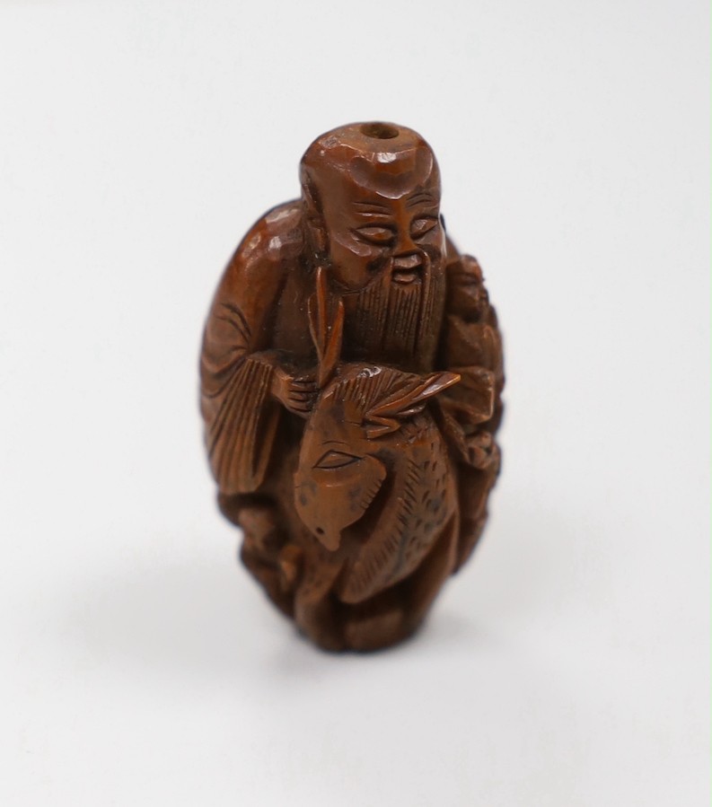 Five Chinese peach stone carvings, largest 4.2cm and a coquilla nut egg shaped box
